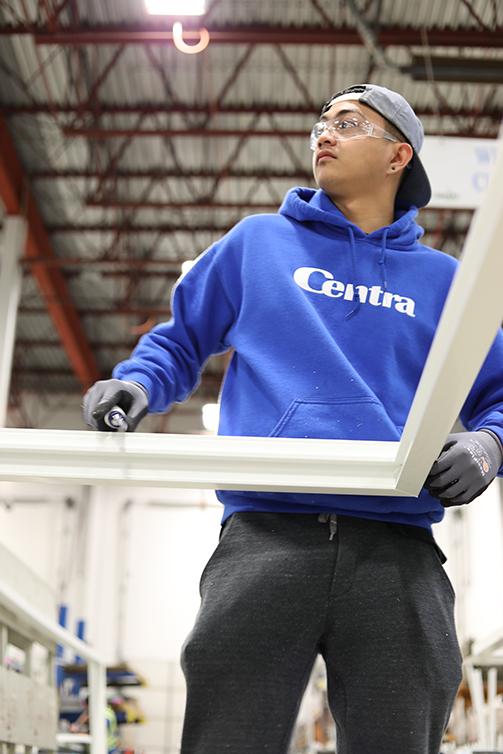 Centra Windows measuring vinyl windows in manufacturing plant