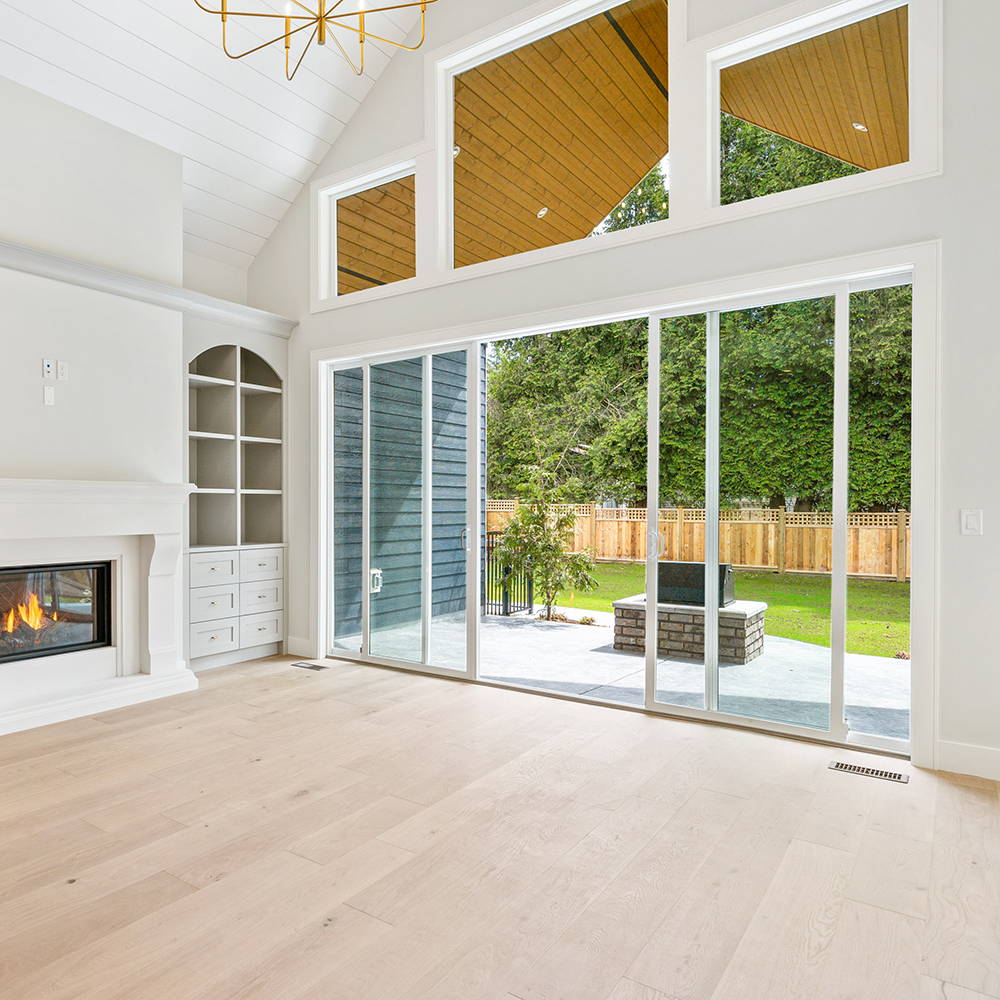 Lounge with a Unique Door and Window Mix. This lounge makes the most of its backyard with large white vinyl picture windows.